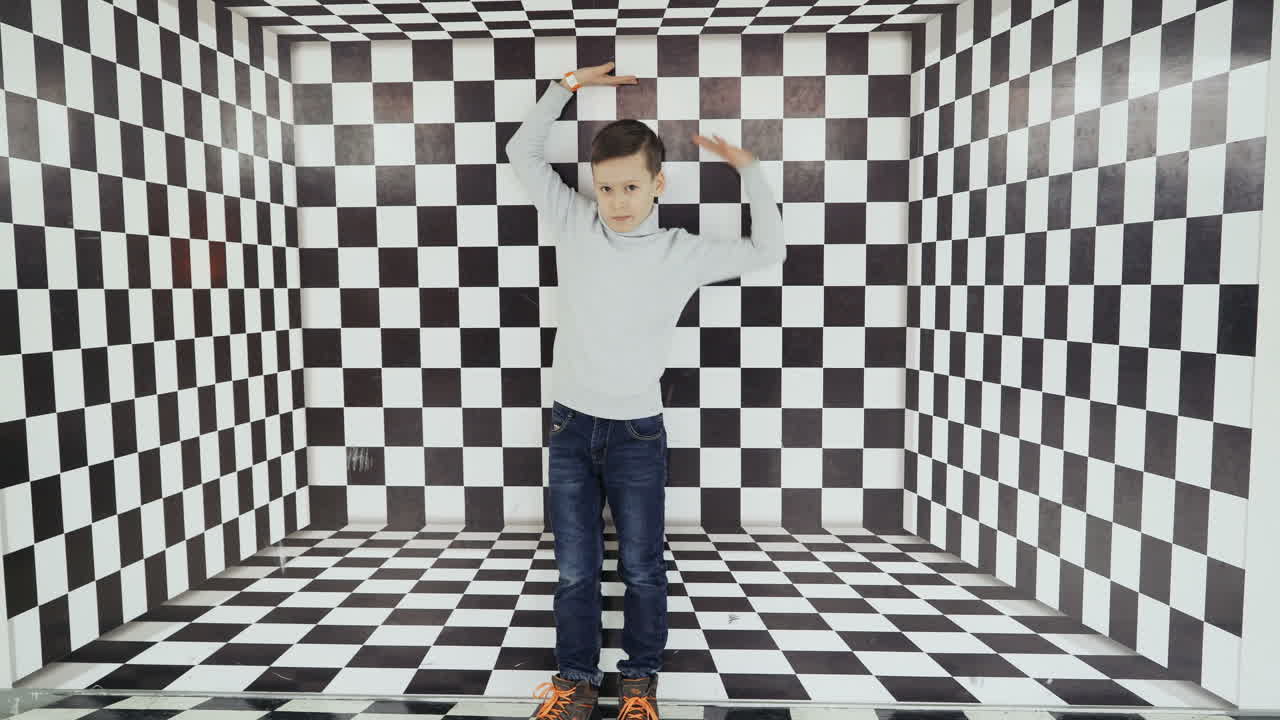 Boy watching a whirlwind of optical illusion in the science center