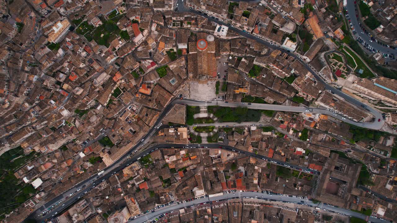 Top down aerial shot of Modica old town layout with San Giorgio Duomo Cathedral. Sicily, Italy.
