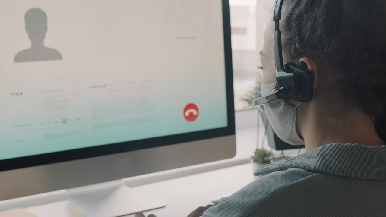 Woman on Video Call with Headset and Mask