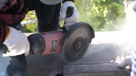 Asian-Worker-Doing-Roof-Tiles-Installation,-Cutting,-Measuring-Process,-Close-Up