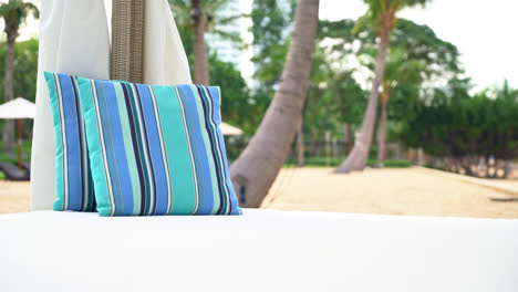 comfortable pillow on pavilion near beach - travel and vacation concept