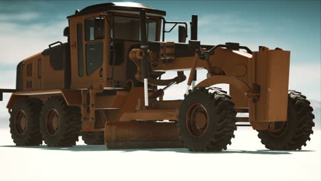 road grading machine on the salt desert road