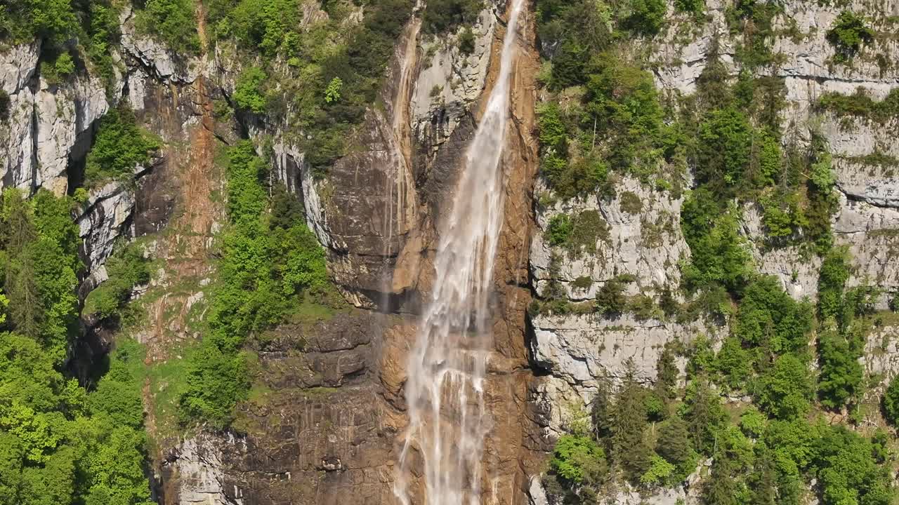 Waterfall in Seerenbachfälle, Betlis, surrounded by lush greenery and cliffs