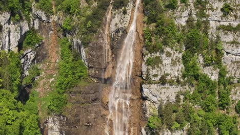 waterfall in seerenbachfälle, betlis, surrounded by lush greenery and cliffs