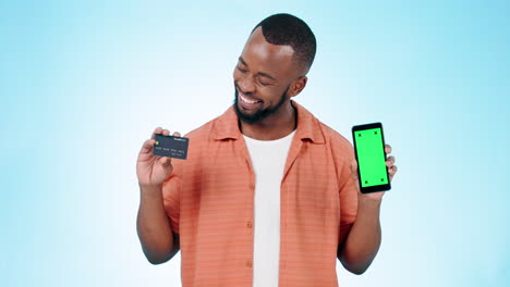 Man,-green-screen-phone-and-credit-card-in-studio