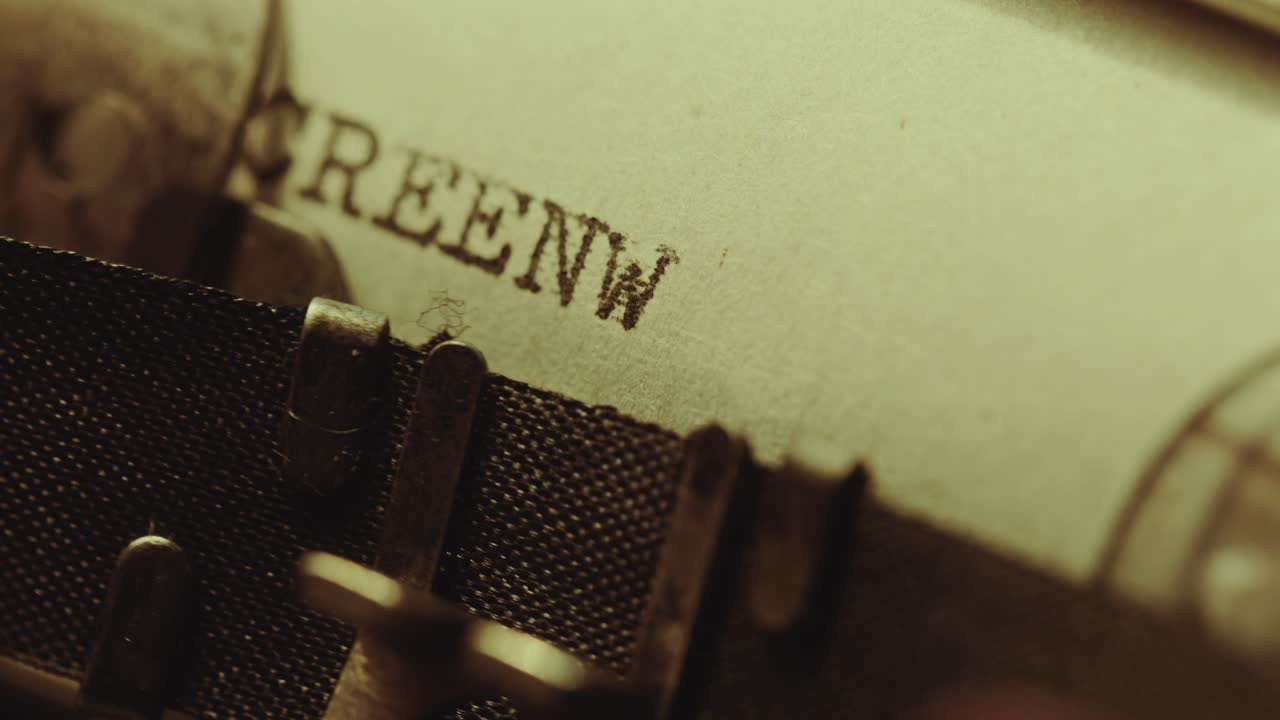 Typing Screenwriting in Upper Case on Paper with Typewriter