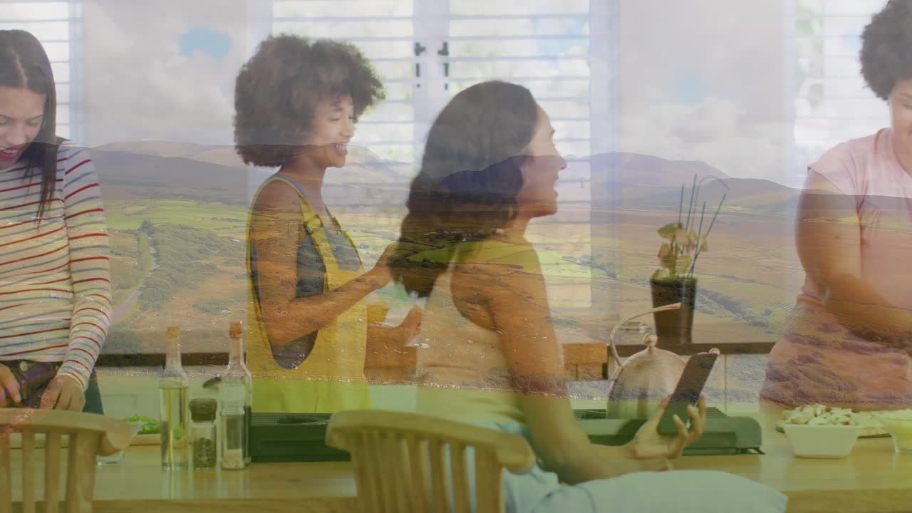 Cooking in kitchen, women with landscape animation overlay, preparing meal together