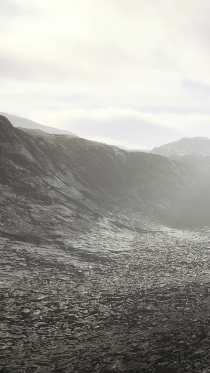 Landscape with rocks and hills during cloudy day in remote area
