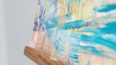 slow motion 240 fps close up of the hands of a professional artist who paints abstract paintings - slow motion 240 fps, close up of the hands of a professional artist who paints abstract paintings. drawing a picture with oil paints