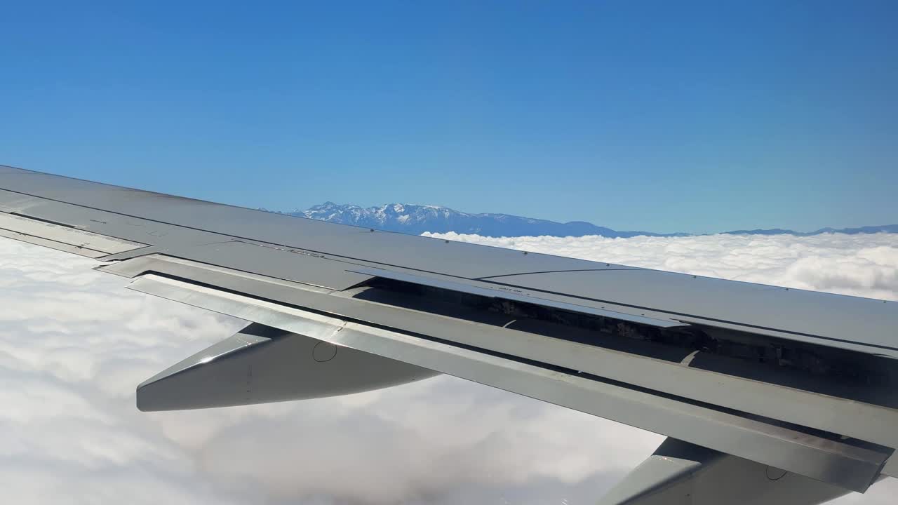 Fly over Atlas mountains mountain range in North Africa Morocco above clouds
