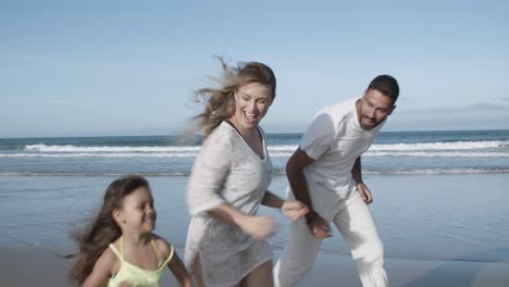 happy parents couple and little kid wearing pale summer clothes