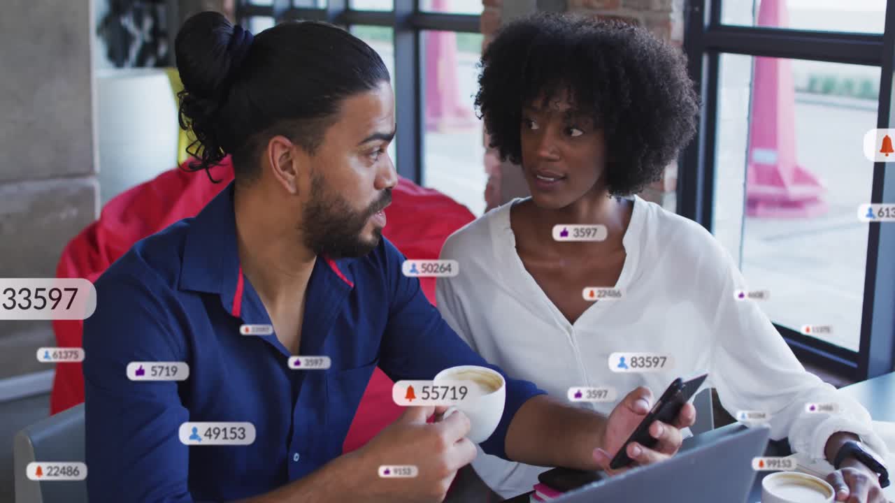 Animation of social media icons over diverse business people