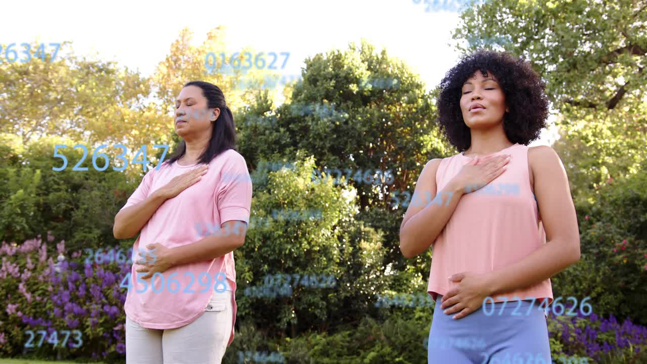 Two women standing on lawn breathing slowly, causing blue digits growing between them for health