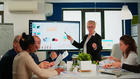 chief analyst holding meeting presentation for a team of economists