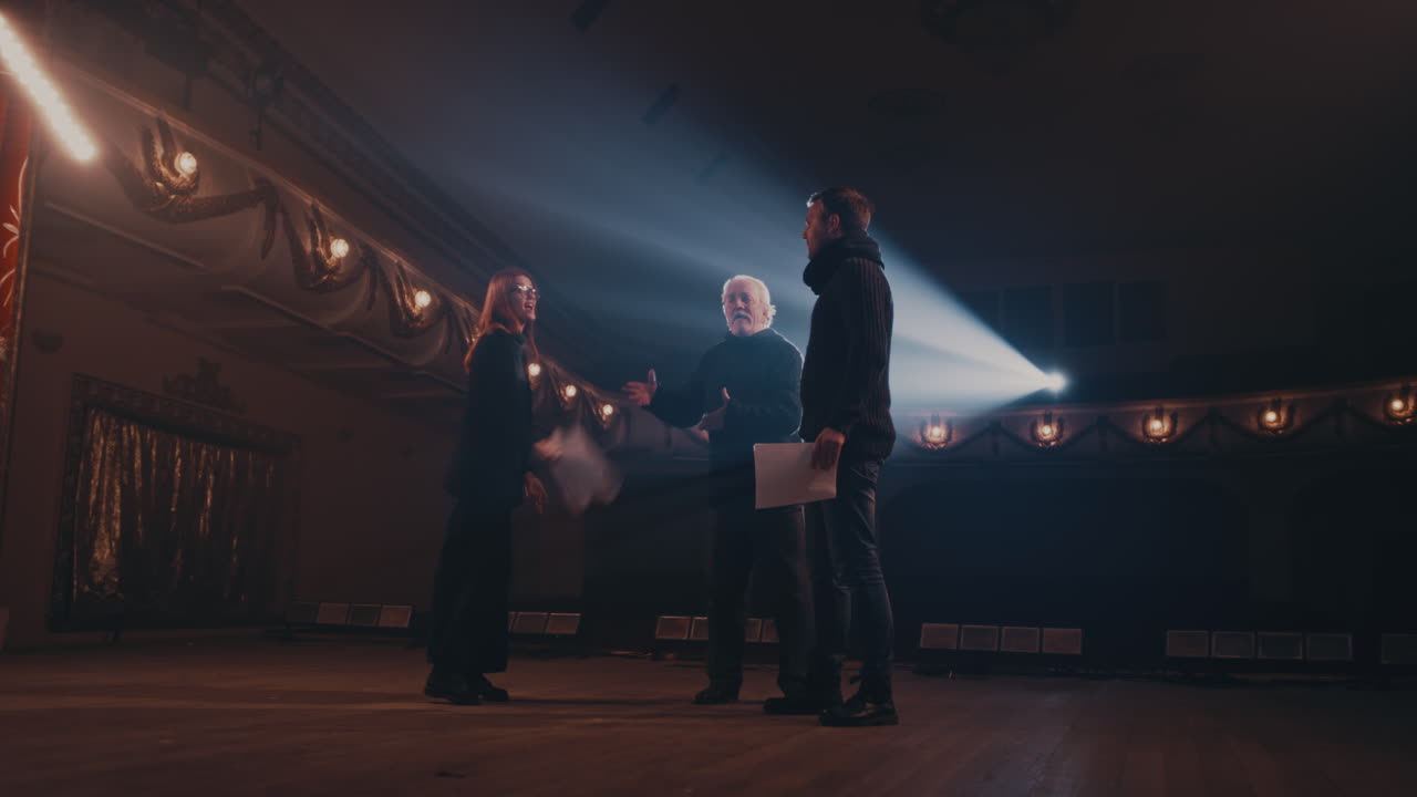 Men and Woman Acting out Quarrel Scene on Stage Zoom out View of Angry Actress Shouting at Actors then Throwing Papers and Walking Away during Rehearsal on Stage in Theater