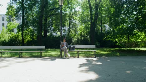 businesswoman using smartphone in park