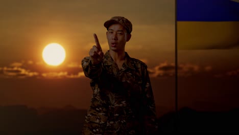 soldier in camouflage uniform with ukraine flag