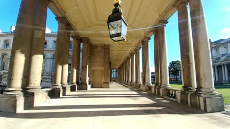 a graceful walk through the historic grounds of greenwich, featuring the iconic chapel and surrounding classical architecture. the video captures the timeless beauty of stone facades
