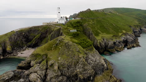 coastal lighthouse and hiking path, aerial view