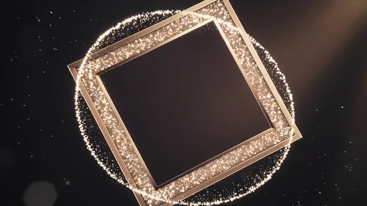 Striking golden particle column sparking burst, forming rotating square frame for studio display