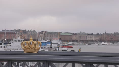 famous golden crown on skeppsholmsbron bridge in central stockholm, sweden