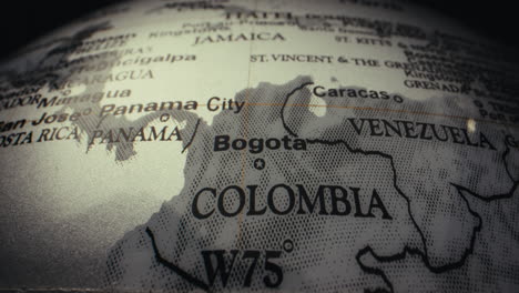 close-up of a world globe focusing on colombia