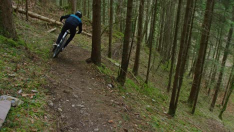 a mountain biker rides fast down a secret trail