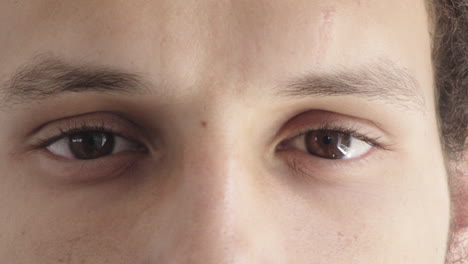 close up of mixed race man eyes looking at camera contemplative reflection vision eyesight