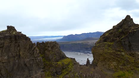 Aerial-revealing-shot-of-a-glacier-with-small-icebergs-melting-in-Iceland