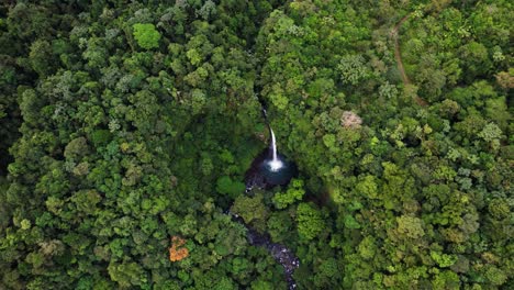 epic fortuna waterfall aerial shot in middle of vast green rainforest