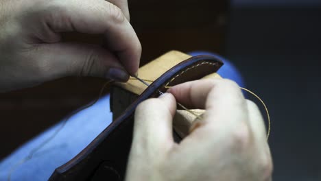 sewing leather with a stitching pony support made to hold the  piece in place viewed from pov