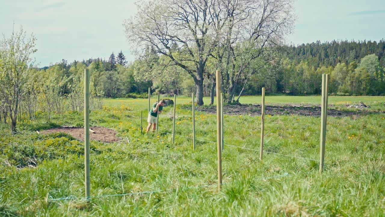 Timelapse Of Man Building A Fence In Rural Norway