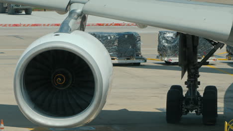 the wing of a passenger airliner with a powerful jet engine on it