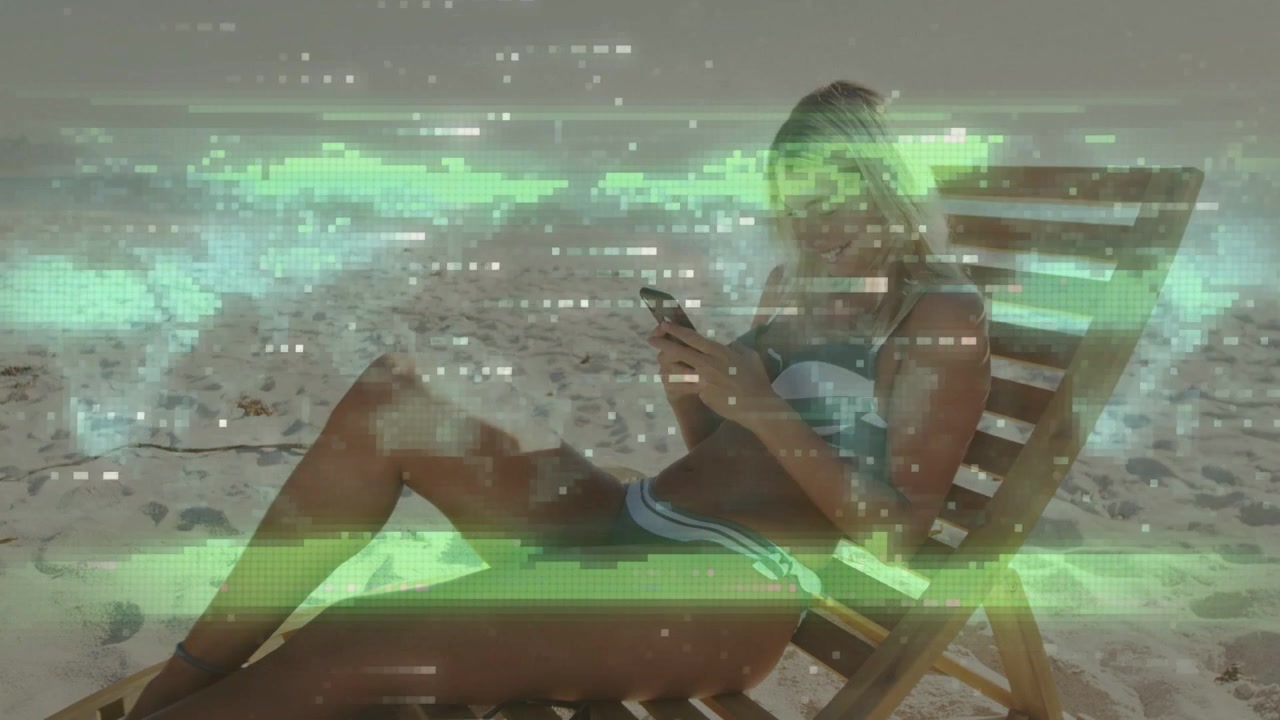 Woman reclining on chair lifting phone, tapping phone, sitting up smiling under green glitch travel