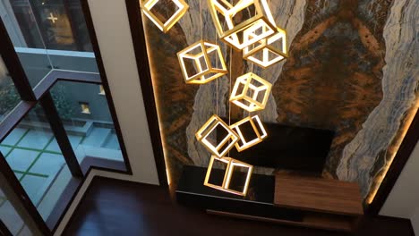 high hanging square ceiling lights viewed from first floor