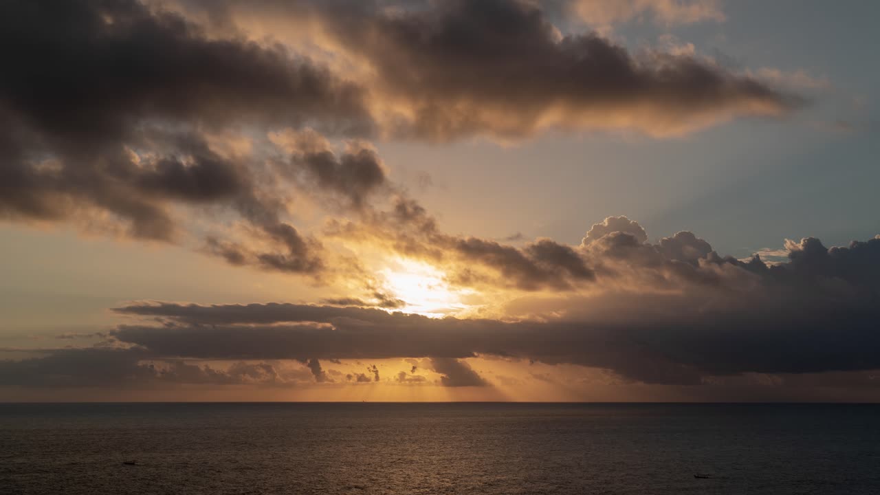 Sunset or Sunrise over the Ocean with Dramatic Clouds