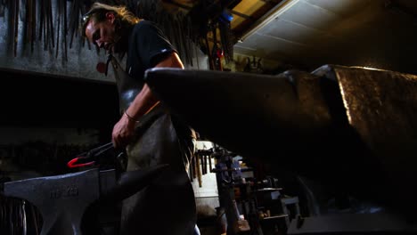 Blacksmith-working-on-a-iron-rod