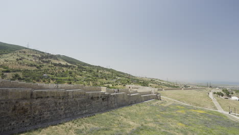 ancient stone wall on a hillside