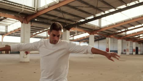 male dancer in an empty warehouse