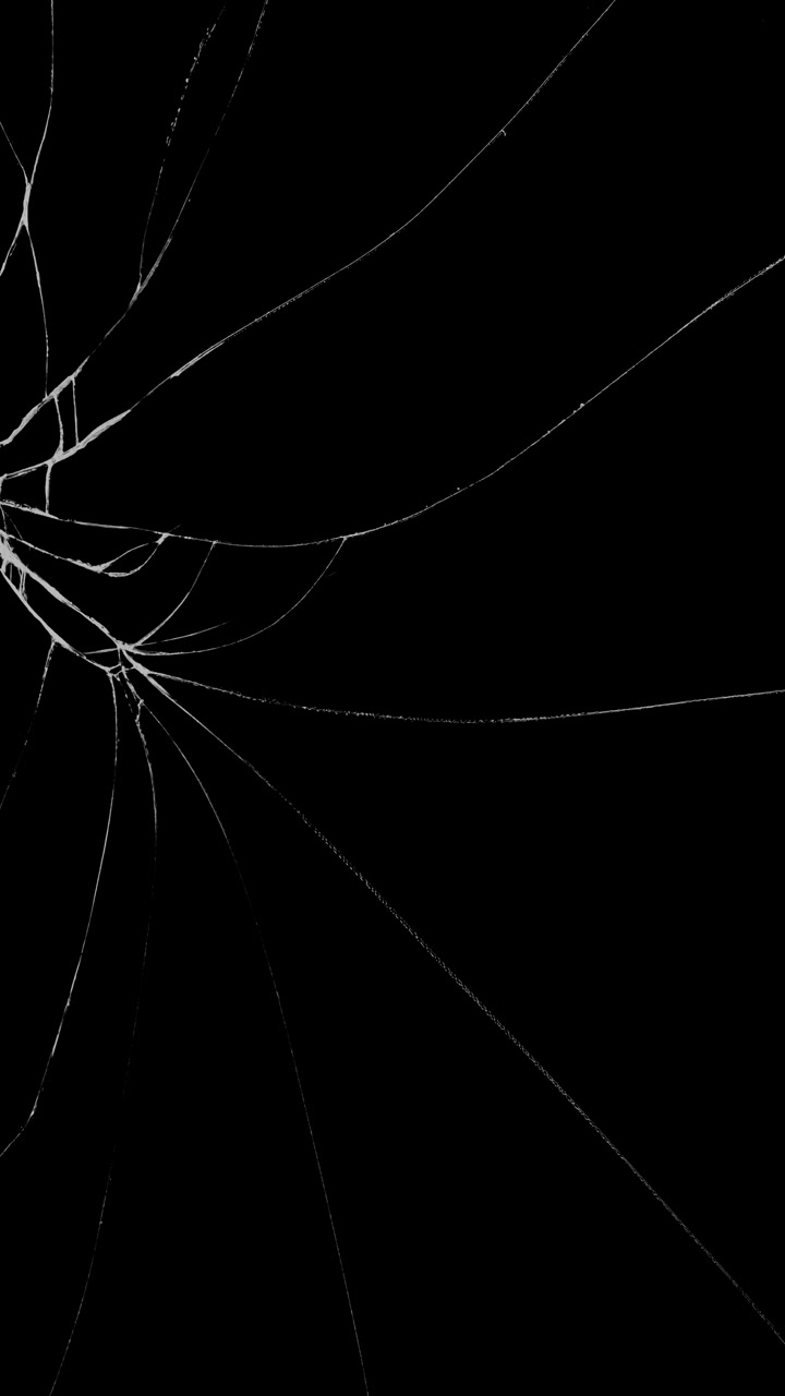 Vertical format shattered glass or cracked screen effect originating from the corner on black background
