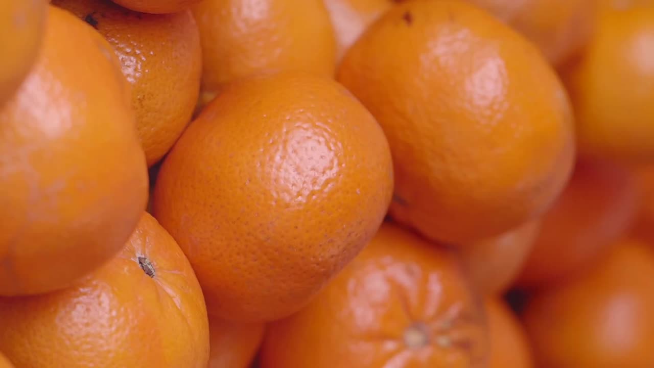 Hand picking oranges