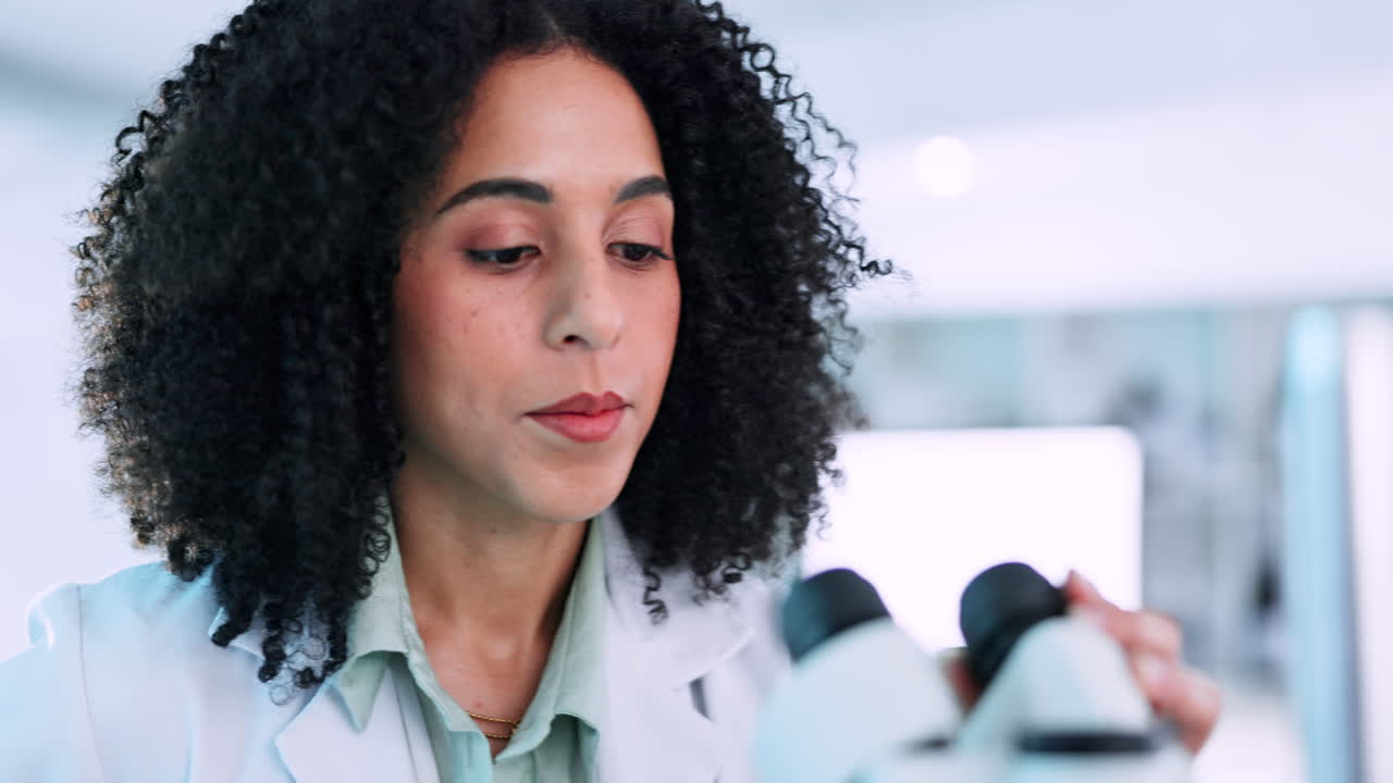 Scientist, woman and microscope in laboratory