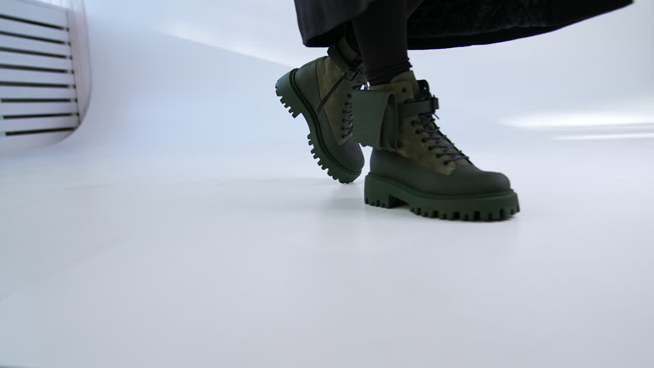 Woman walking in trendy green boots
