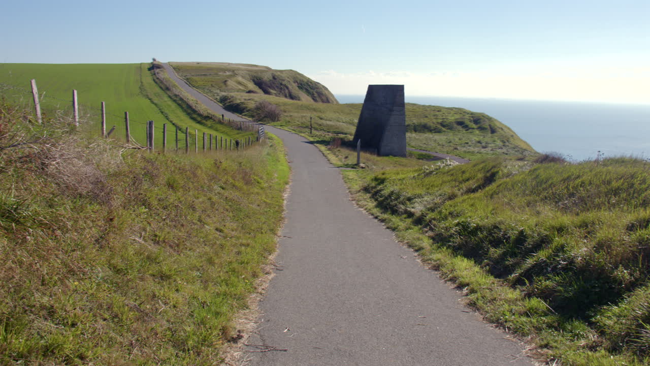 Extra wide panning shot looking down the north downs way onto abbot's Cliff sound mirror