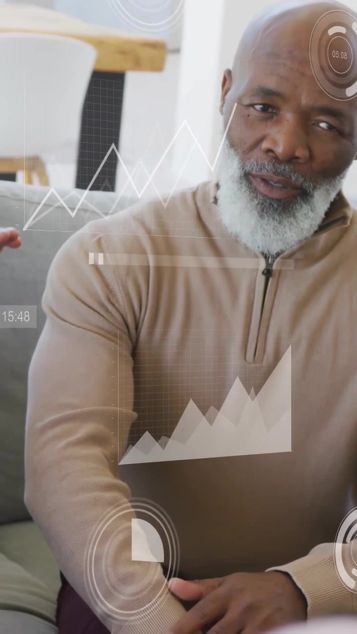 Vertical video: Senior man sitting getting woman's soft hand as AR HUD moving around him for care
