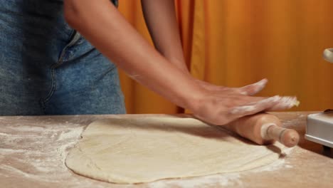 woman rolling out dough