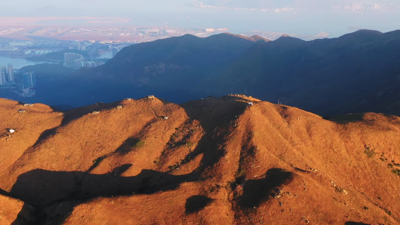 Aerial landscape above Sunset Peak in Hong Kong with city in background