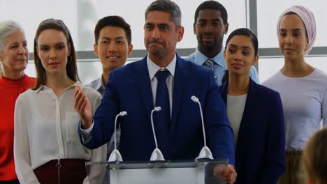 businessman speaking on the podium with his colleagues in the business seminar 4k