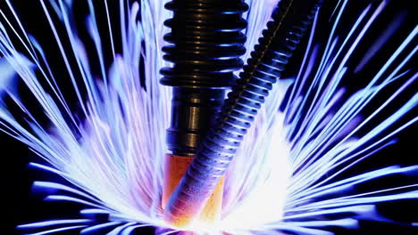 close-up of an industrial welding or plasma cutting process with bright blue and purple sparks