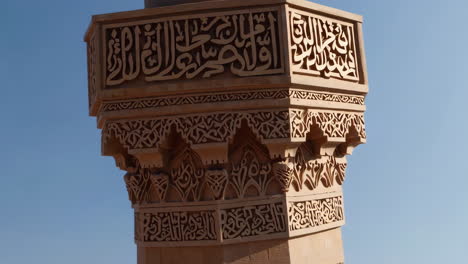 aerial view of a mosque and minaret with detailed carvings